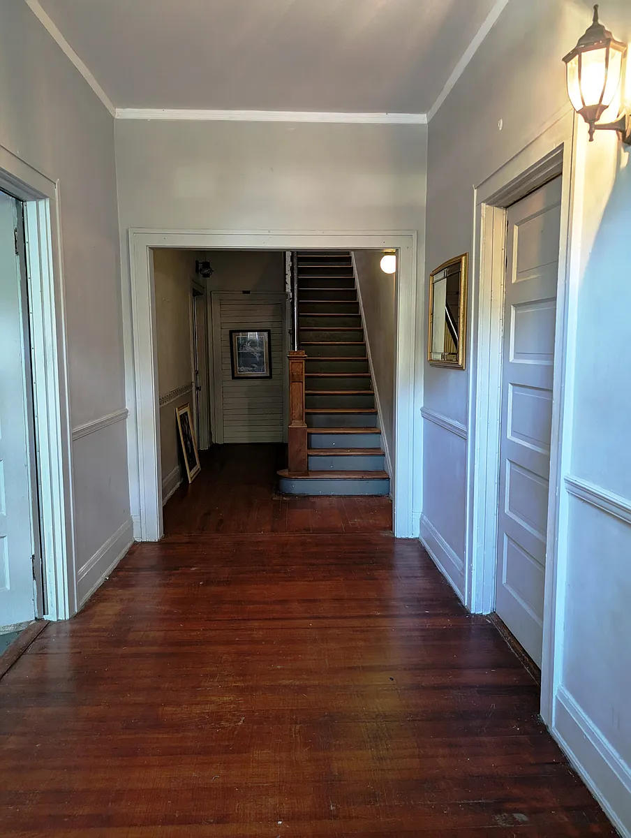 Common foyer & stairs to 1 BR apartments - 1713 Nash St NW #A