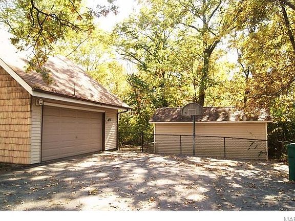 Two car garage with separate out building