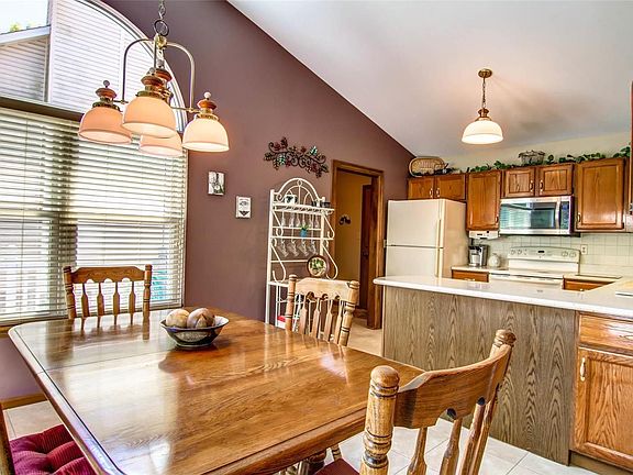 Breakfast Room with newer windows and window treatments. . . .