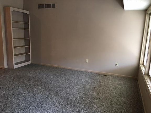 Standing at back patio door looking to one corner of living