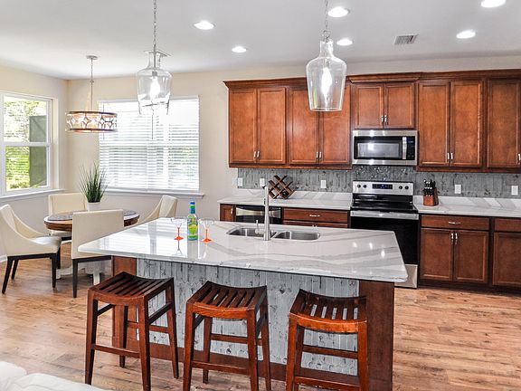 Large kitchen island with roomy seating.