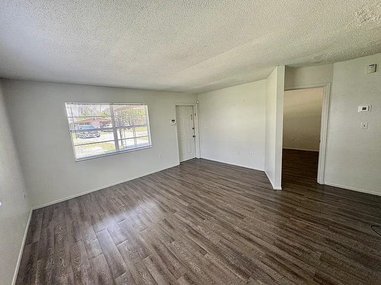 Interior photos are of a neighboring unit with identical floor plan. Paint color is the same, but the flooring is actually ceramic tile.