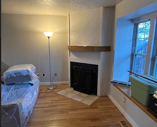 Fireplace and window nook in front of home