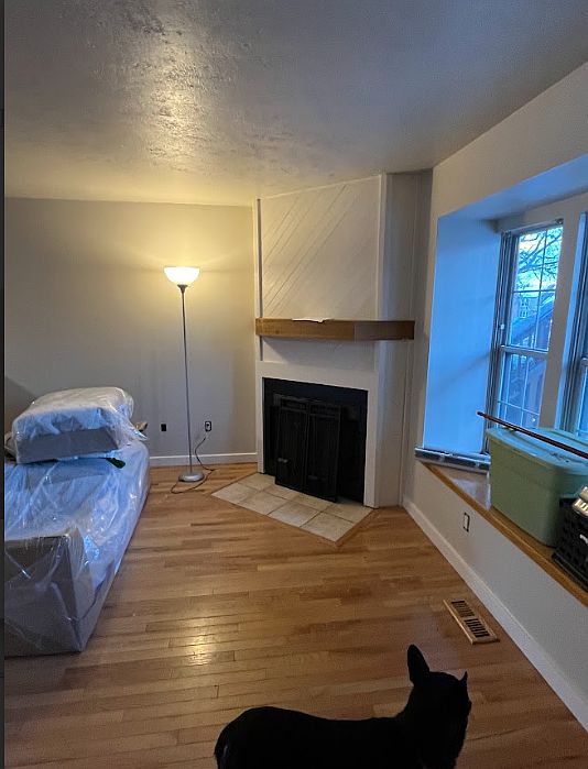 Fireplace and window nook in front of home