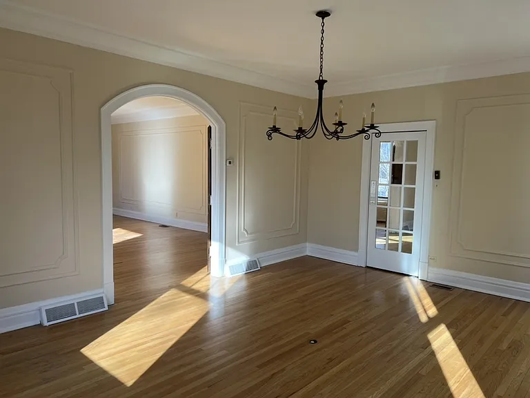 Formal dining room with door to adjacent butler's pantry