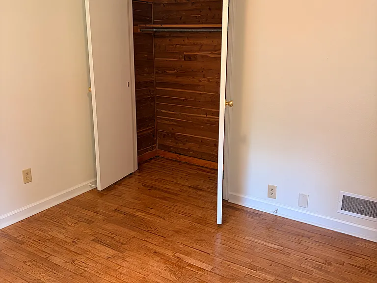 cedar closet in 2nd bedroom with hardwood floors