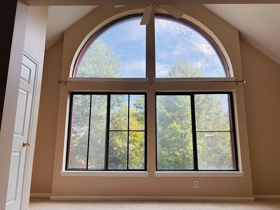 Sunroom faces the trees in the courtyard.