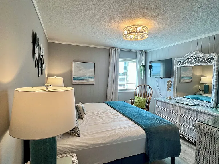 Main bedroom seating and TV