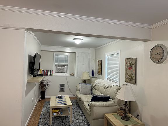 Living room, picture makes it look smaller than it is. Leather couch is a pull out sleeper.