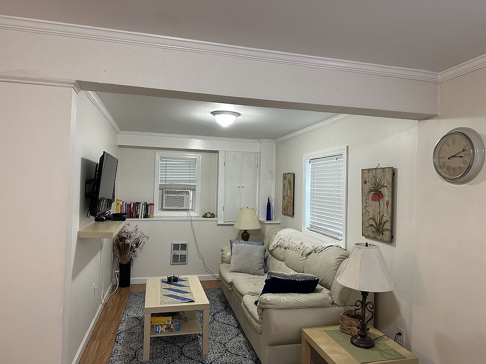Living room, picture makes it look smaller than it is. Leather couch is a pull out sleeper.