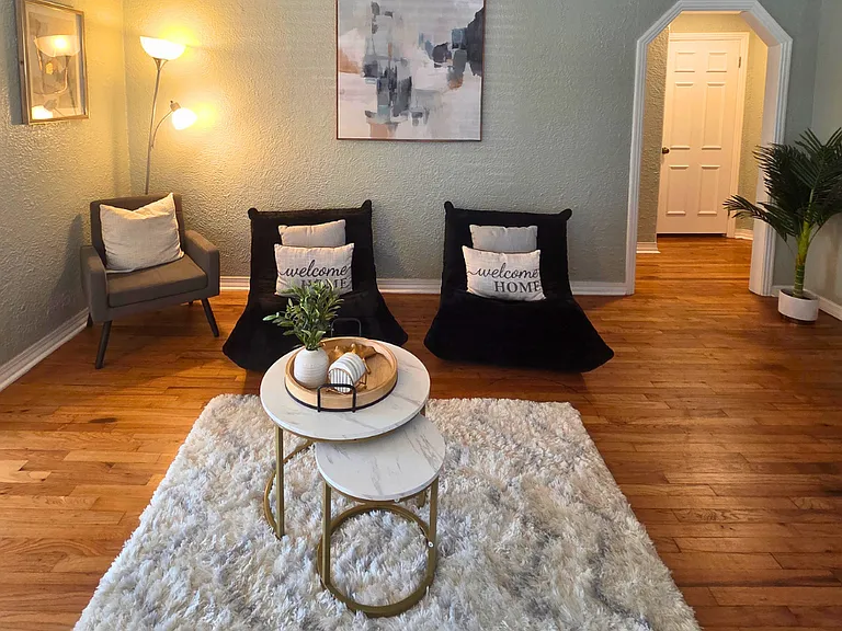 Beautiful lamps and wall art create a warm and inviting atmosphere
