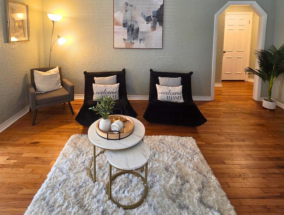 Beautiful lamps and wall art create a warm and inviting atmosphere