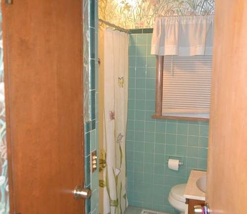 The main floor bathroom is centrally located.  It has a tub/shower combo, linen closet and solid surface vanity.  The second full bath is located in the basement.