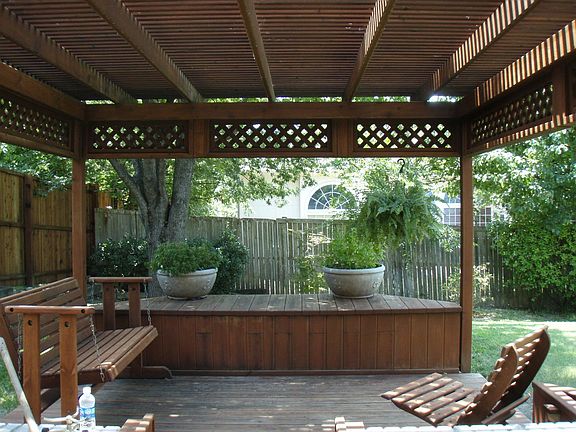 scenic backyard with mature trees and shade