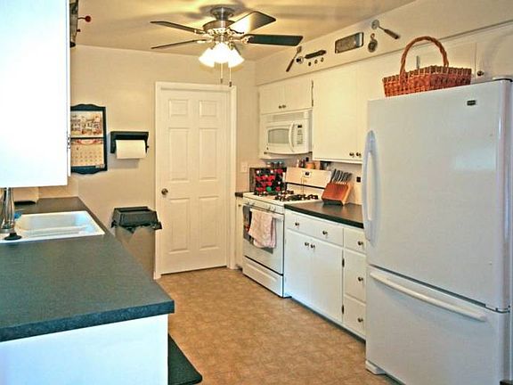 This awesome kitchen features updated appliances, counter tops ceiling fan and easy to care for vinyl flooring.