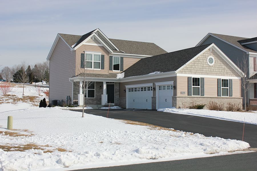 Great curb appeal with a side load garage and front porch.  Nicely landscaped!