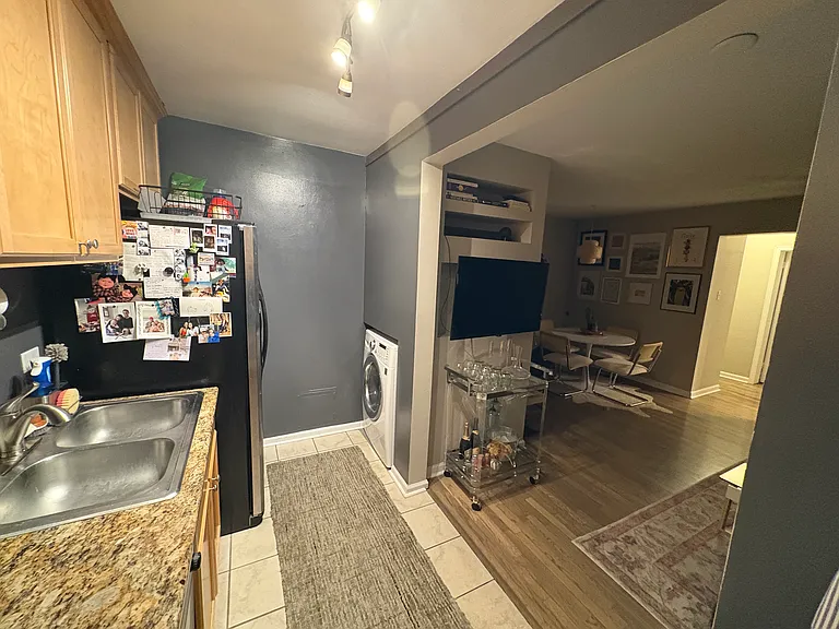 kitchen with washer/dryer photo... looking into main living area