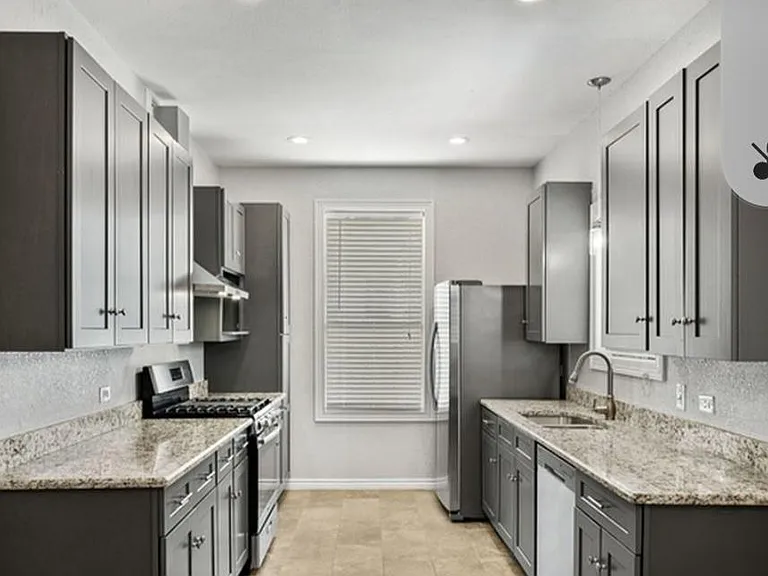 Kitchen with stainless steel appliances and granite countertops. Appliances included.