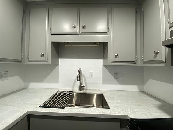 All new, gorgous quartz countertop. huge new sink, new faucet, and base cabinets.