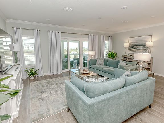 Living room- patio door to screened porch with gulf views!