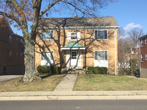 Pleasant Ridge is a very desirable street. Note the big oak in the front yard. There are 4 garages across the back at basement level and each tenant has one garage with electric opener. We do require good credit - 650 or higher. No pets and no smokin