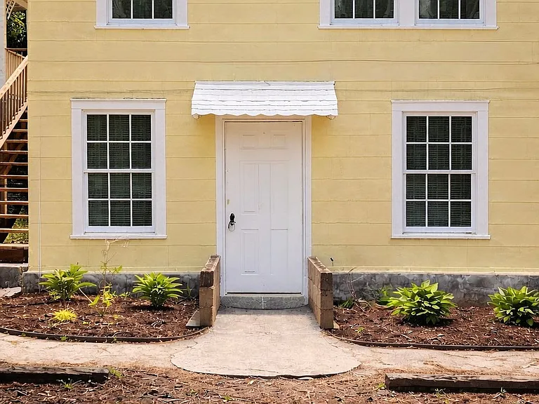 Front entrance to Unit A with private access and nearby parking