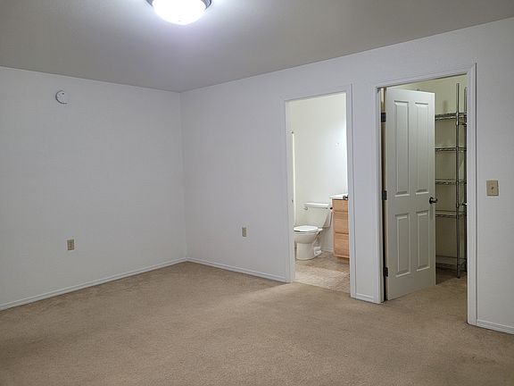 Master bedroom with bathroom and closet