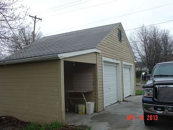 Two car Garage with a storage shed