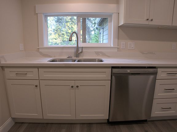 New countertops, cabinets, and dishwasher.