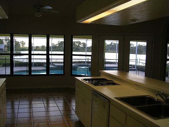 Through kitchen to pool and lake.