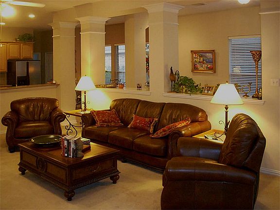 Open great room with half walls to the kitchen and sunroom.