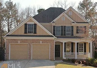 Beautiful two-story home in BridgeMill is full of charm.