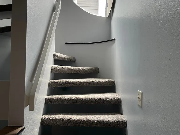 Stairway from living room to bedrooms