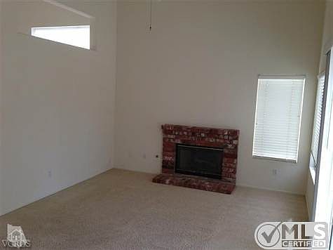 Family room with a wood burning fireplace