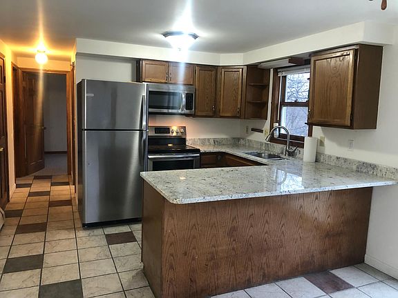 Kitchen/breakfast bar with new appliances and new granite counters