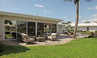 Large patio overlooking dock/water