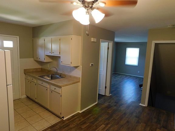 view of kitchen, basement stairs and bathroom