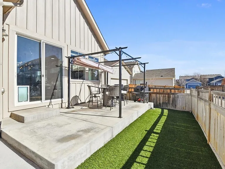 Zero maintenance back yard. Turf and patio