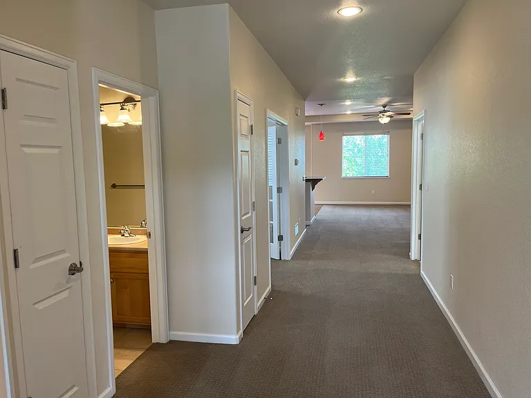 view from entry towards living area. Bedrooms and 2nd bath are on the left.