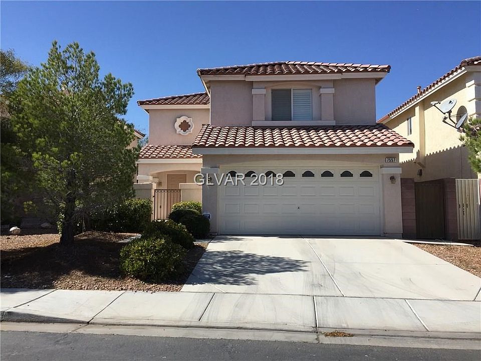 Exterior front with gated courtyard entry