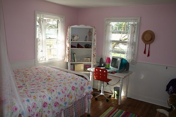 One of smaller bedrooms. Wainscotting, attic access, built-ins in closet.