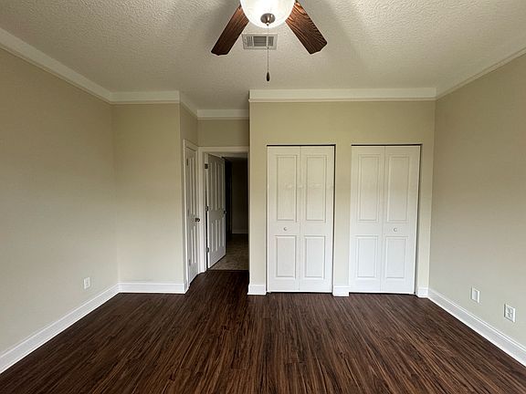 Large master bedroom, can accommodate a king size bed and two nights and a dresser.