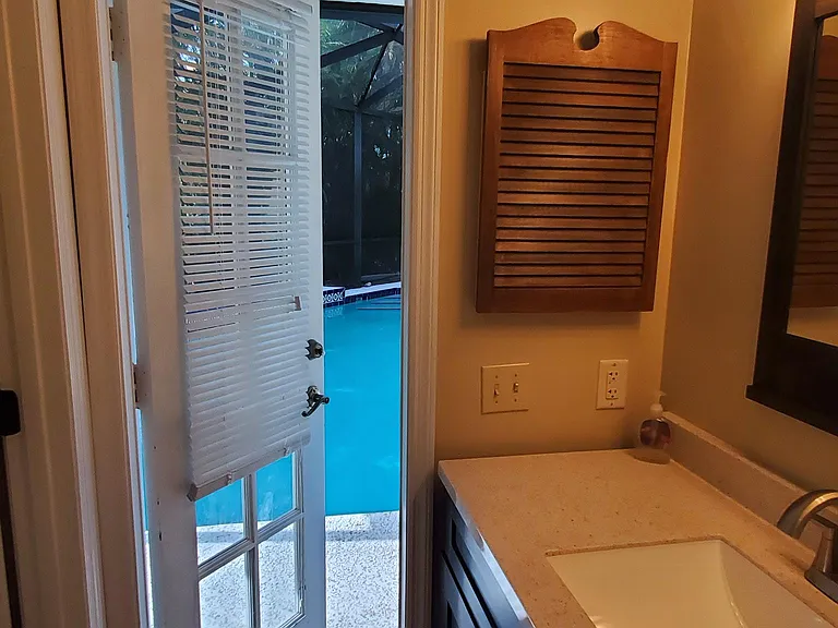 master bathroom opens to the pool area