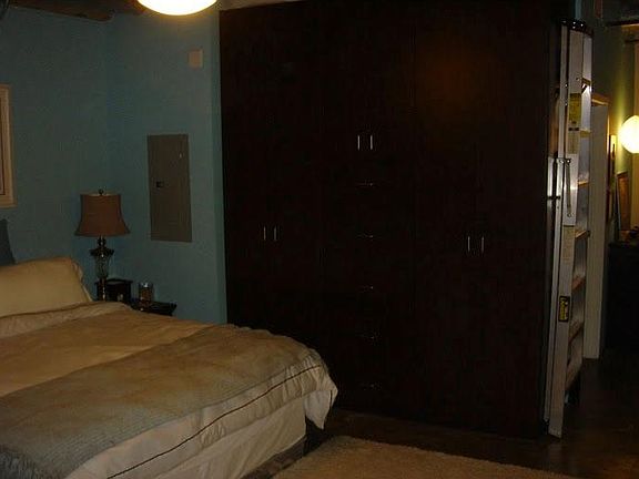 Bedroom has been newly painted a neutral silver drop. Awesome custom California Closet.