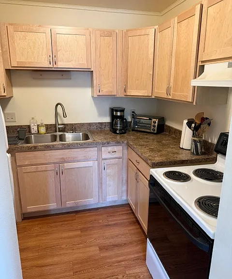Full Kitchen with dishwasher, stove, microwave, toaster oven, coffee maker, pots/pans, silverware, dishes, etc.