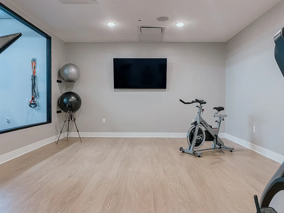 Elevate your fitness routine with this sleek and modern home gym design.
