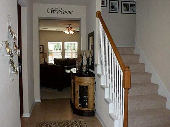 The tiled entry has ample space for furniture.