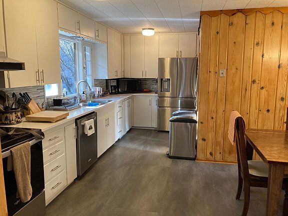 Updated kitchen with granite counters, new sink, updated cabinetry, new flooring and new appliances.