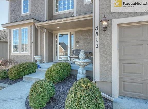 An inviting covered porch welcomes you home.