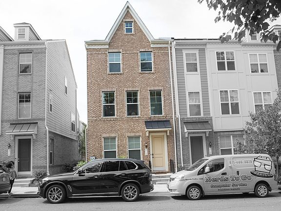 Exterior of home (front) with brick facade. Plenty of street parking for guests